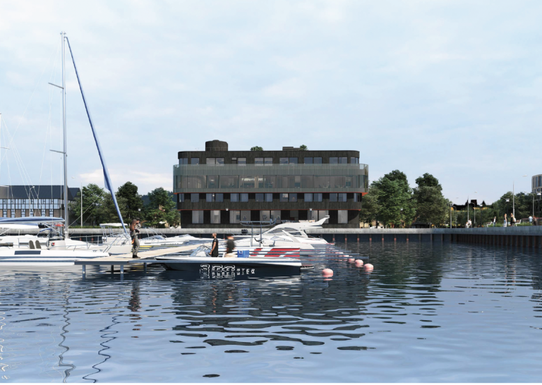 Byggnad framför vatten