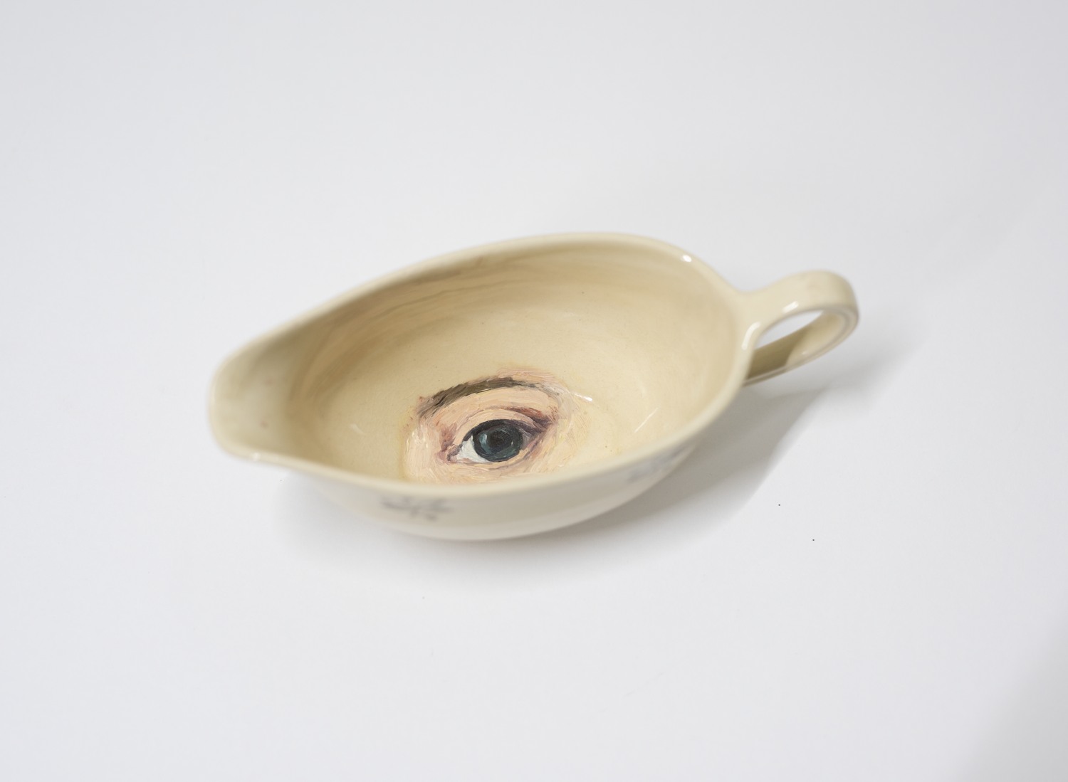 En såskopp med ett öga i